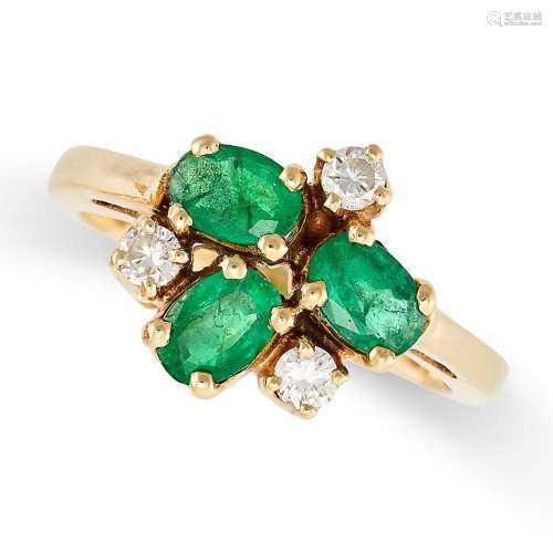 AN EMERALD AND DIAMOND RING set with three oval cut emeralds...