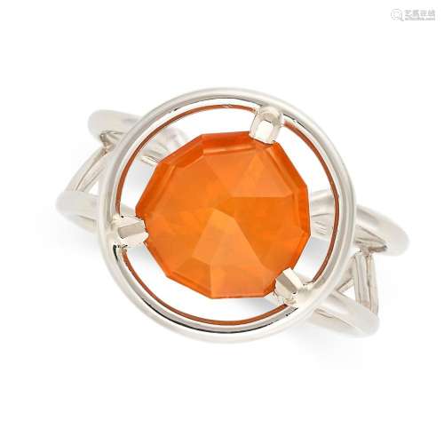 A FIRE OPAL RING in platinum, set with a faceted fire opal o...