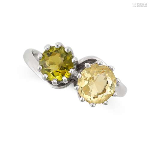 A PERIDOT AND CITRINE TOI ET MOI RING in 18ct white gold, se...