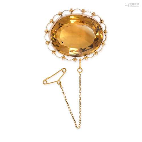 A CITRINE BROOCH in 9ct yellow gold, set with a large oval c...