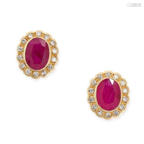 A PAIR OF RUBY AND DIAMOND STUD EARRINGS in 18ct yellow gold...