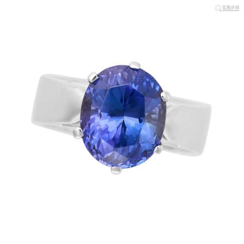 A TANZANITE RING set with an oval cut tanzanite of approxima...