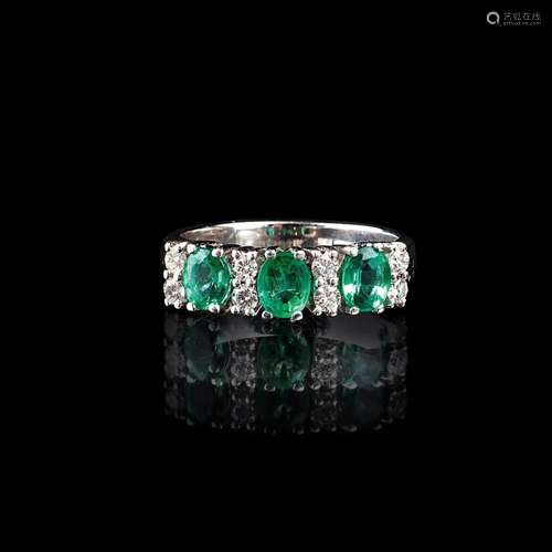 An Emerald Diamond Ring.