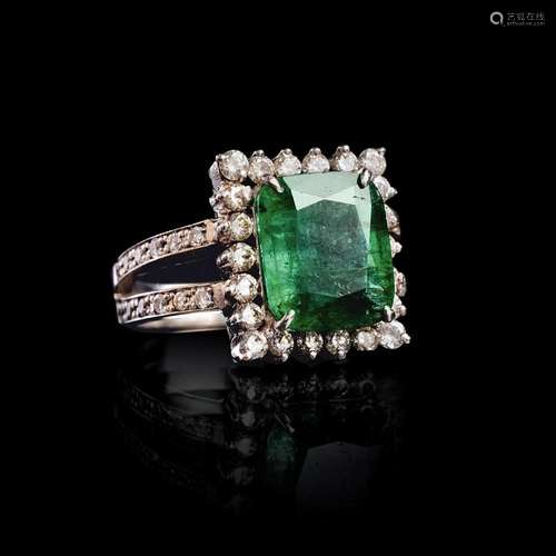 An Emerald Diamond Ring.