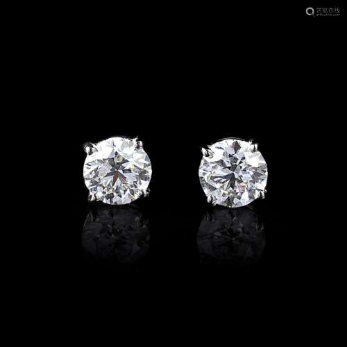 A Pair of Rare White Solitaire Diamond Earstuds.