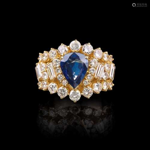 A Diamond Ring with Pearshaped Sapphire.