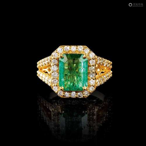 An Emerald Diamond Ring.