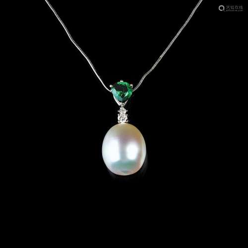 A Southseapearl Emerald Pendant on Necklace.