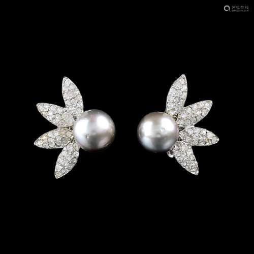 A Pair of Diamond Earclips with Tahiti Pearls.