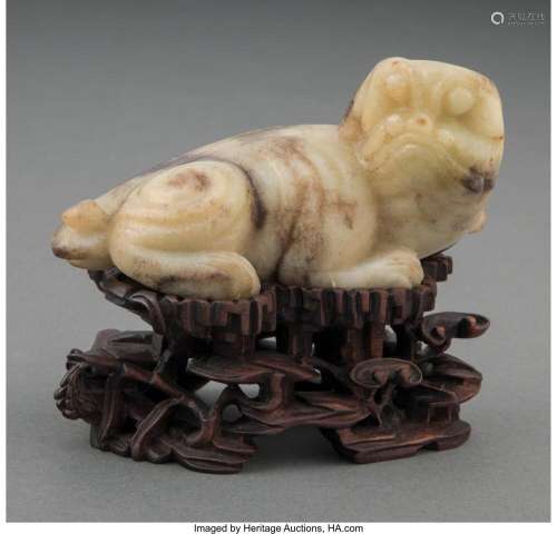 A Chinese Carved Mottled White and Celadon Jade Mythical Bea...