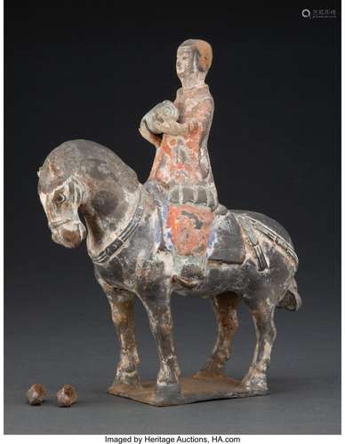 A Chinese Pottery Figure of a Horse and Rider, Wei Dynasty 1...