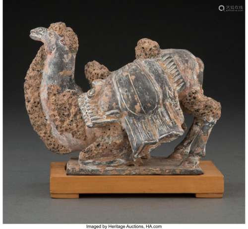 A Chinese Grey Pottery Figure of a Recumbent Camel, Northern...