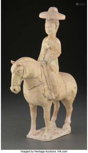 A Chinese Glazed Pottery Horse with Rider, Sui/early Tang Dy...