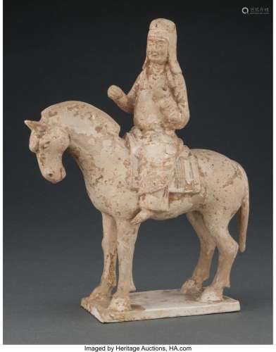 A Chinese Pottery Figure of a Horse and Rider, Sui Dynasty 1...