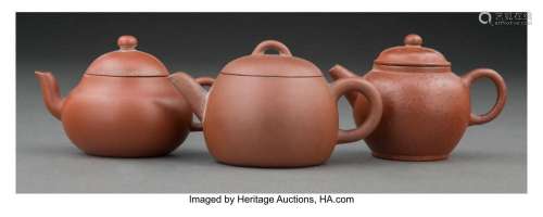 A Group of Three Chinese Yixing Pottery Teapots Marks: (vari...