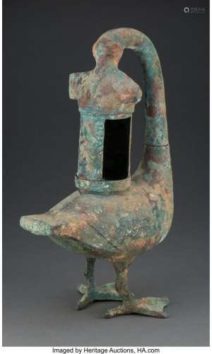 A Chinese Bronze Goose-Form Lamp, Han Dynasty 16-1/2 x 10-1/...