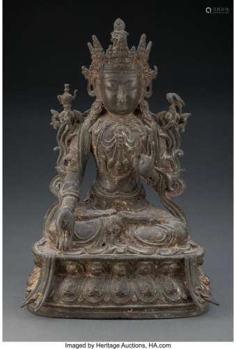 A Chinese Bronze Guanyin, Ming Dynasty 13 x 9 x 6-1/2 inches...