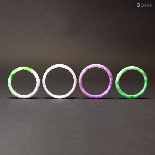 A GROUP OF 4 JADEITE BRACELETS