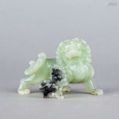 A GROUP OF TWO JADE LIONS