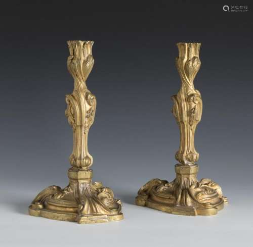 Pair of Louis XV style candlesticks. France, ca. 1870.Gilded...