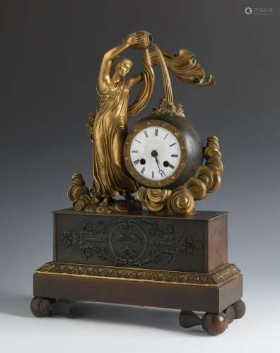 Empire table clock. France, early 19th century.Patinated and...