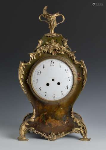 Rococo style clock. France, 19th century.Polychrome wood and...