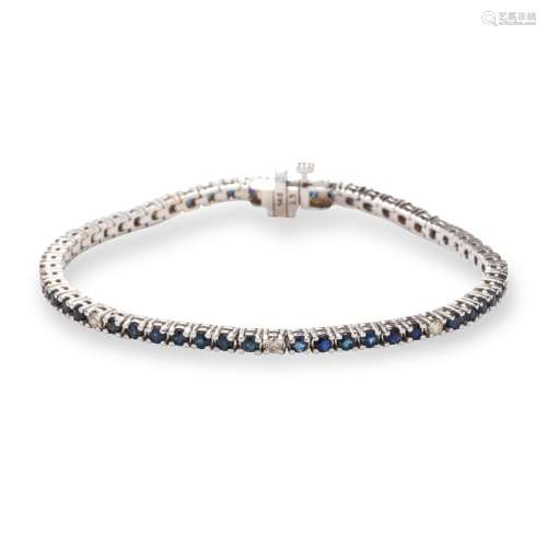 A sapphire, diamond and fourteen karat white gold bracelet