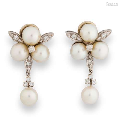 A pair of pearl, diamond and fourteen karat white gold ear c...