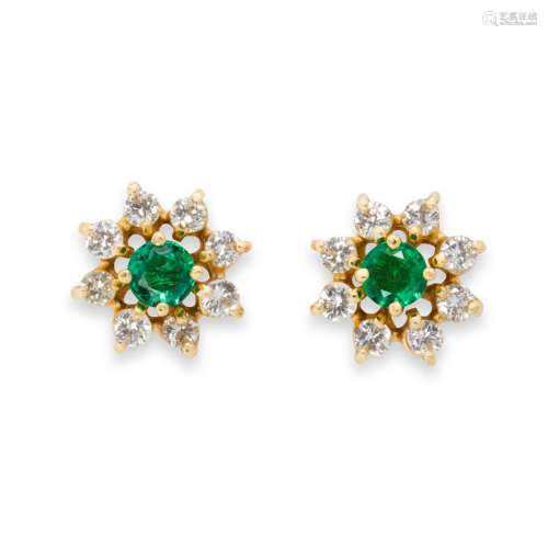 A pair of emerald, diamond and gold ear jackets