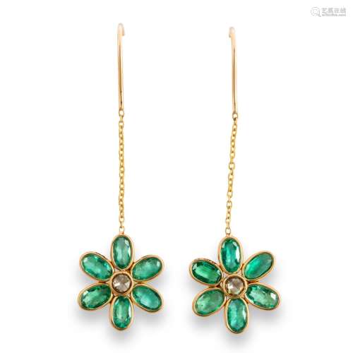 A pair of emerald, diamond and eighteen karat gold earrings