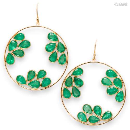 A pair of emerald and eighteen karat gold earrings