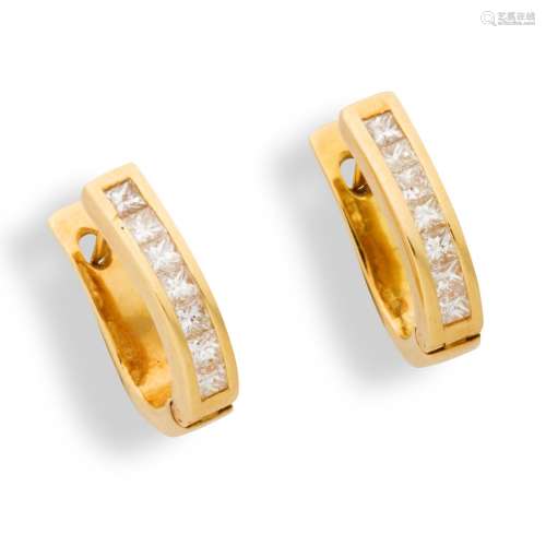 A pair of diamond and eighteen karat gold earrings