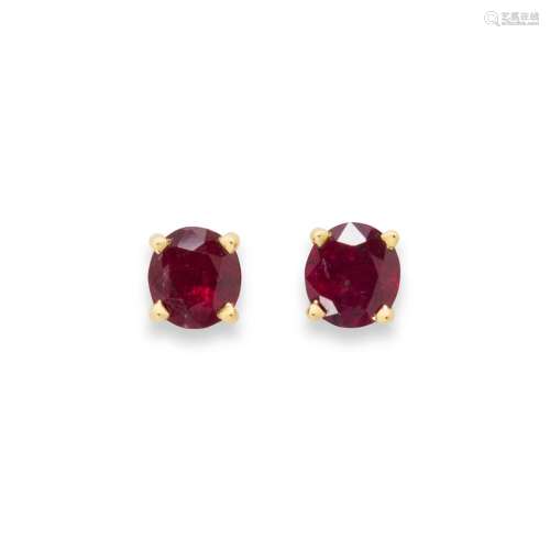 A pair of ruby and eighteen karat gold earrings