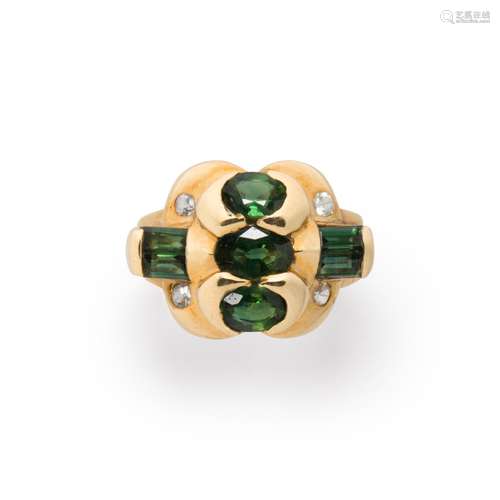 A green sapphire, white sapphire and ten karat gold ring