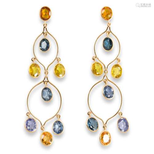 A pair of blue or yellow sapphire and eighteen karat gold ea...