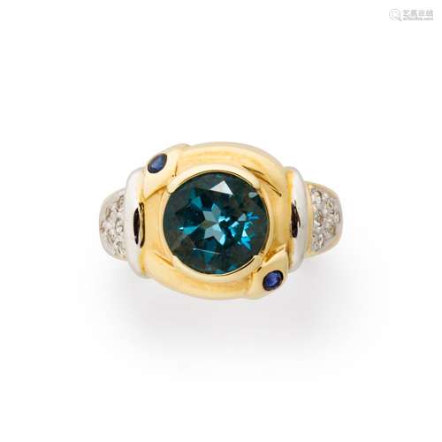 A gemstone and fourteen karat gold ring