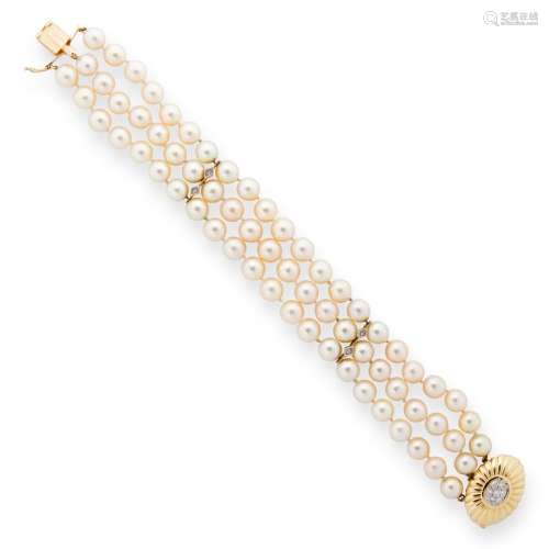 A pearl and fourteen karat gold bracelet