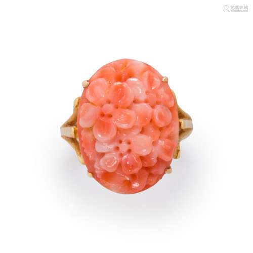 A coral and fourteen karat gold ring
