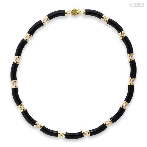 A black onyx and fourteen karat gold necklace