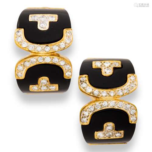 A pair of onyx, diamond and eighteen karat gold earrings