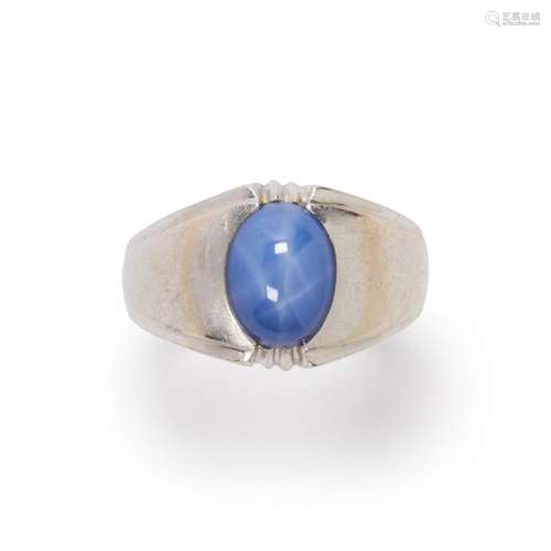 A star sapphire and fourteen karat white gold ring