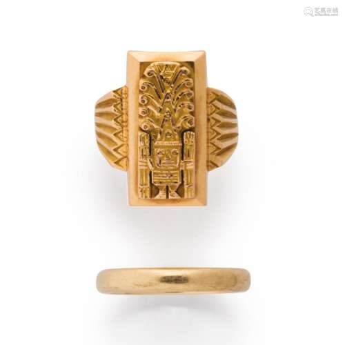 A group of fourteen or eighteen karat gold ring