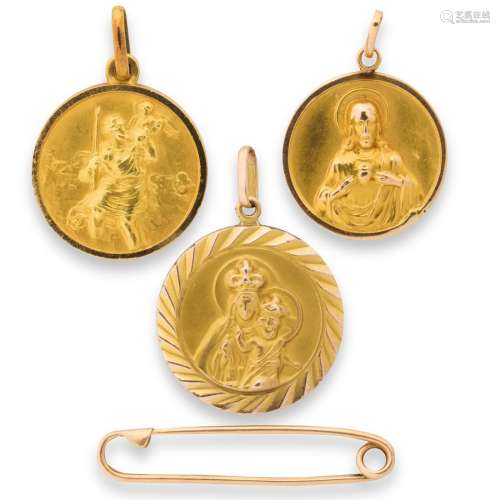 A group of gold or gold-filled pendants and accessory