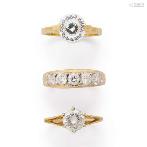 A group of CZ and gold rings