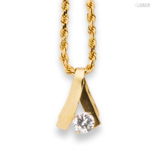 A CZ and fourteen karat gold pendant necklace