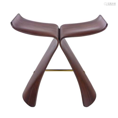 A Vitra molded palisander wood Butterfly Stool with brass fi...