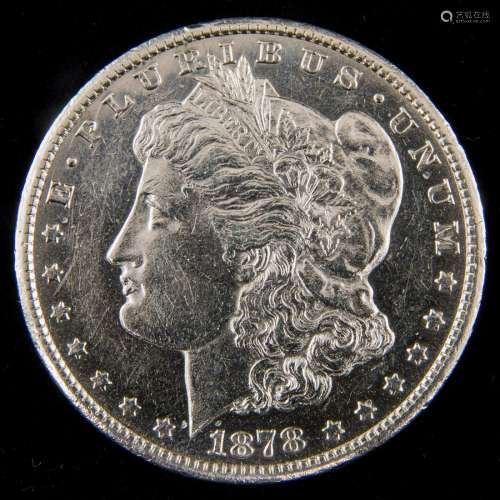 An 1878 CC Morgan dollar, Au/Bu