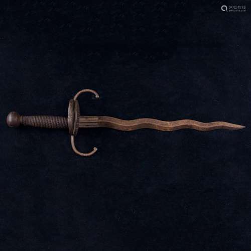 A Spanish Colonial sword the curvy kris form blade fitted wi...