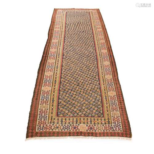 An antique Kilim carpet