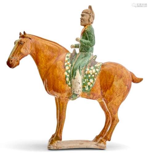 A Chinese Sancai Glazed Pottery Figure of an Equestrian Heig...